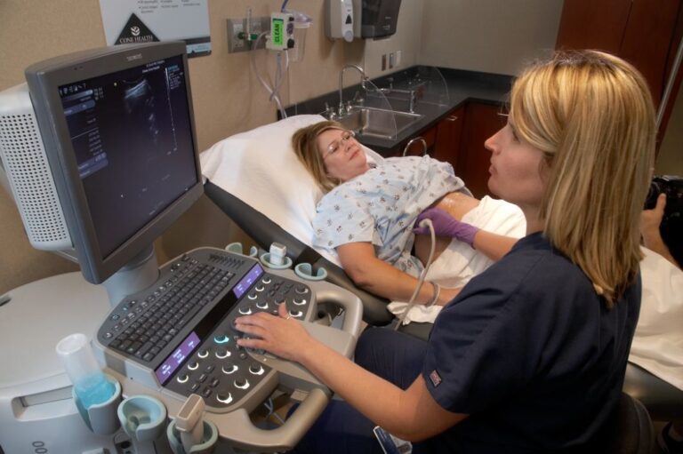 A Greensboro Radiology Sonographer performs an ultrasound on a patient.
